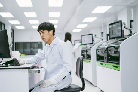 Scientist at bench computer